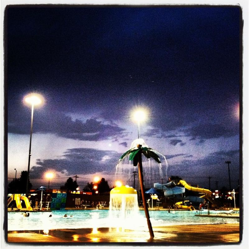 Night view of Reno Swim and Slide water park in Oklahoma.